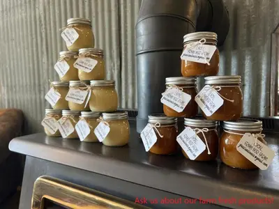 a group of jars of honey on a table at Runaway Express Coach in Oliver