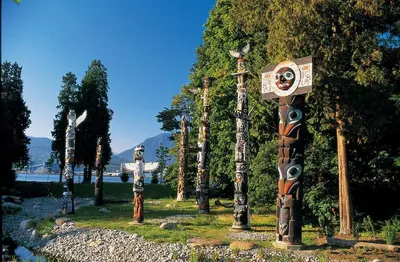 a group of totem poles in a park at Awesome 2BR in Lynn Valley in North Vancouver