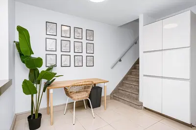 a dining room with a table and a plant at Chic Central 4BDRM Home-King Bed-AirHockey-Mins DT in Edmonton