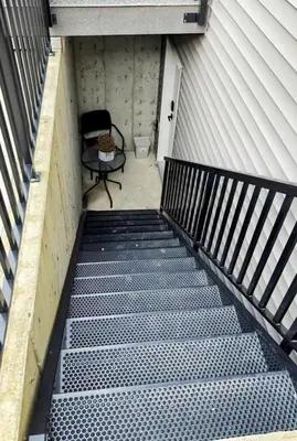 an empty stairway with a chair and a table at Newly Built Cozy 2BR Suite Langley Event Center in Langley