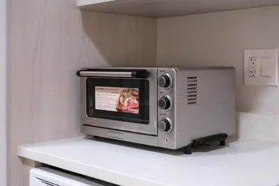 a microwave sitting on top of a counter at Newly Built Cozy 2BR Suite Langley Event Center in Langley