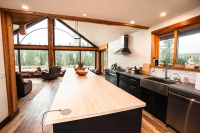 a kitchen with a wooden counter top in a house at River Safari Eagles Nest in Blue River