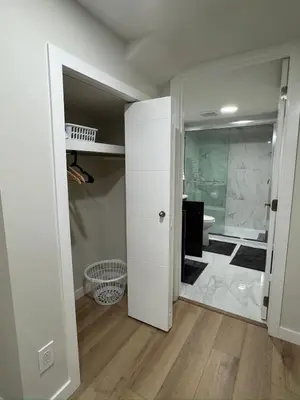 a room with a bathroom with a walk in shower at DJoshuas place in Edmonton