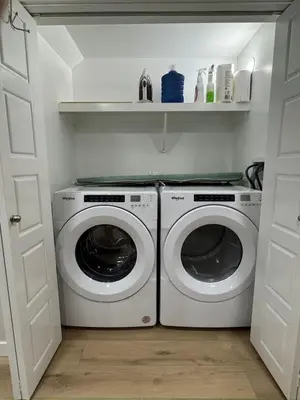a laundry room with a washer and dryer at DJoshuas place in Edmonton