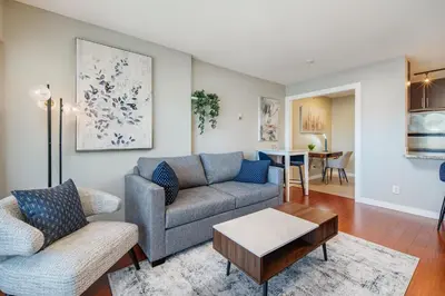 a living room with a couch and a table at Cozy Condo! Central Location! Plus One Free Parking! in Vancouver