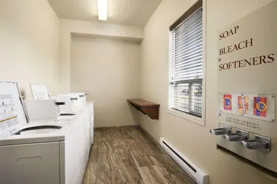 a dental office with a sink and a window at Ramada by Wyndham Edson in Edson