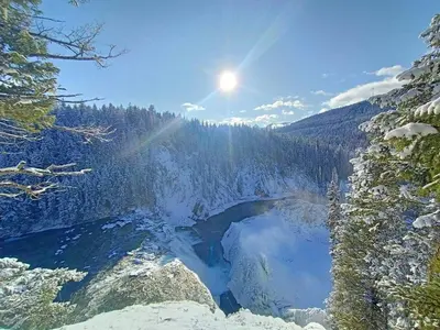 a lake in the middle of a snow covered forest at Amazing Views, Northern Lights, Stargazing Entire Guest Suite in Golden, BC Canada in Golden