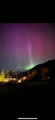 a rainbow in the sky over a mountain at Amazing Views, Northern Lights, Stargazing Entire Guest Suite in Golden, BC Canada in Golden