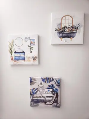 two drawings of people in a bath tub on a wall at Calgary Cozy Nest 2BR Suite in Calgary