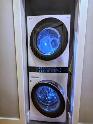 a washing machine and a dryer in a room at Cozy home in Vancouver in Vancouver