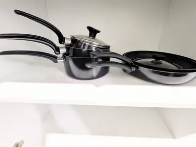 a pot and pan sitting on top of a shelf at Glacier Ridge 1 bedroom haven in Calgary