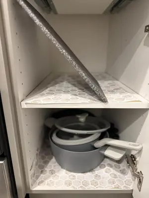 a cupboard with a sink and a toilet in it at Relax, Recharge, Repeat 2Bedroom Walkout Haven in Calgary