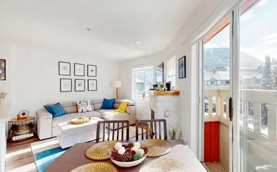 a living room with a couch and a table at Beautiful 1BR in Village Centre in Whistler