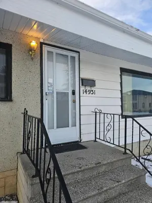 a front door of a house with a number on it at P&N Suites - DELUXE KING ROOM- PARIS in Edmonton