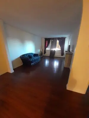 an empty living room with a bed and a window at Cozy & bright private one-bed rm in Edmonton