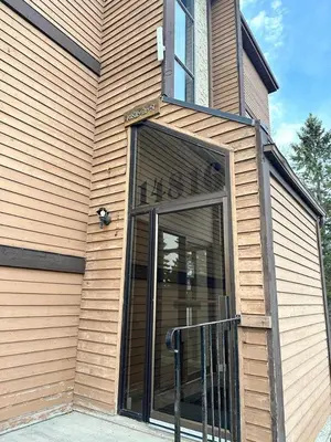 a building with a large glass door on it at Cozy & bright private one-bed rm in Edmonton