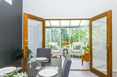a dining room with a table and chairs at Bayview Bed and Breakfast in Mill Bay
