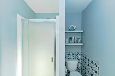 a bathroom with a shower and a toilet at Bayview Bed and Breakfast in Mill Bay