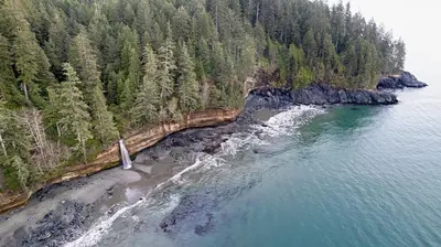 an aerial view of a beach with trees and water at Jordan River Coastal Cottage in Shirley