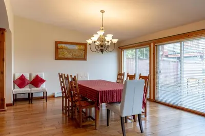 a dining room with a table and chairs at Fort Wine Manor, Entire Private Estate Home in Maple Ridge District Municipality
