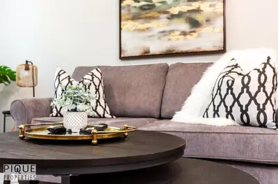 a living room with a couch and a coffee table at Park Life Escape-King Beds-Sleeps 10-Pet Friendly in Edmonton