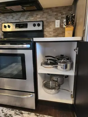 a kitchen with a stove and some pots and pans at Cozy Luxury House in Edmonton