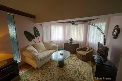 a living room with a couch and a table at Eagle's Nest Resort in Anahim Lake