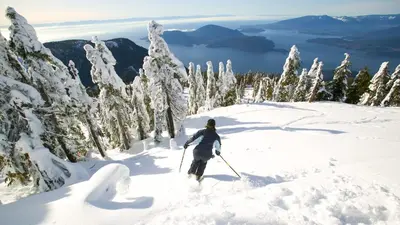 a person on skis in the snow on a mountain at O Charming Bright Queen Bed Room Ensuite in West Vancouver