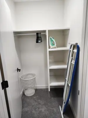 a room with a closet with a ladder and shelves at Super luxury suite in Edmonton