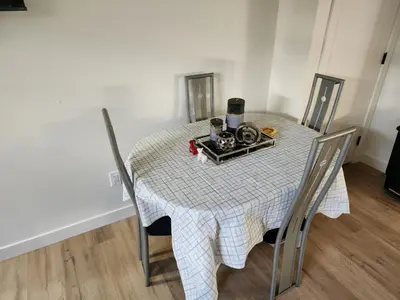a dining room table with a white checkered table cloth at Super luxury suite in Edmonton