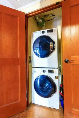 a washer and dryer in a small room at Serene Spruce at Solara Resort in Canmore