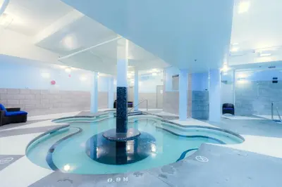 a large swimming pool in a building at Serene Spruce at Solara Resort in Canmore