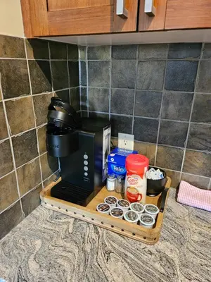 a coffee maker on a shelf in a kitchen at Falcon Crest Canmore Banff in Canmore