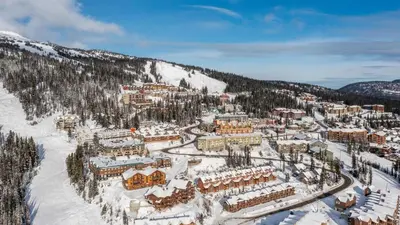 an aerial view of a resort in the snow at Snow Therapy Chalet - Ski In Out, Hot Tub & Mtn View in Big White