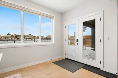 an empty room with white walls and large windows at 2 Bedroom Spacious & Private Guest Suite - King Size Bed TV in Room, 58