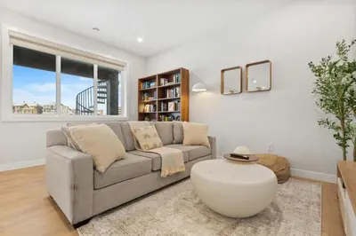 a living room with a couch and a large window at 2 Bedroom Spacious & Private Guest Suite - King Size Bed TV in Room, 58