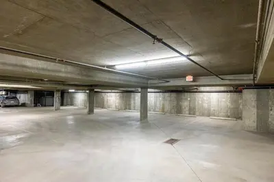 an empty parking lot in an empty parking garage at 901 Fernie by StayIn in Fernie