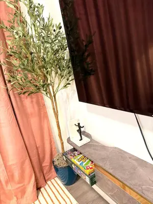 a bathroom with a plant sitting next to a window at 2bed Lagos House Backyard Suites Downtown in Edmonton