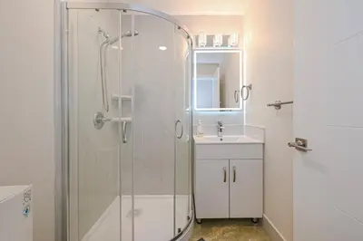a bathroom with a shower and a sink at Cozy Home with 3BR 4Bath near Richmond Steveston Village in Richmond