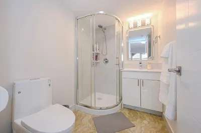 a bathroom with a shower and a toilet and a sink at Cozy Home with 3BR 4Bath near Richmond Steveston Village in Richmond