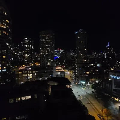 a view of a city at night with at Charming Abode Downtown Vancouver in Vancouver