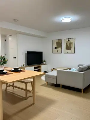 a living room with a couch and a table at Levida Living - Cozy 2 Bedroom Suite at the Heart of Langley in Langley