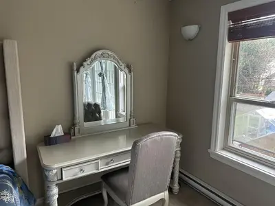 a dressing table with a mirror and a chair at Rosehouse 2Bedrooms sleep 4 2nd floor private bathroom in Coquitlam