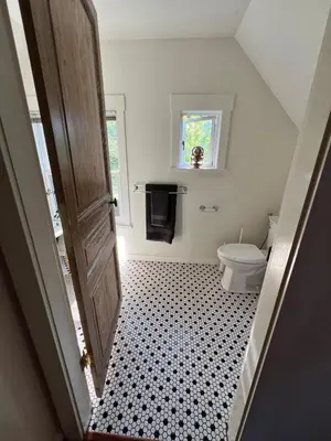 a bathroom with a toilet and a door at 3 level, home near downtown! in Vancouver