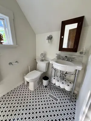 a bathroom with a toilet and a sink at 3 level, home near downtown! in Vancouver