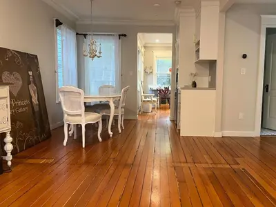 a kitchen and dining room with a table and chairs at 3 level, home near downtown! in Vancouver