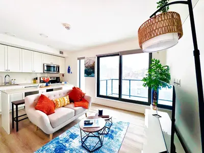 a living room with a couch and a table at Bow River Cabin - Downtown - River Front - Free Street Parking in Calgary