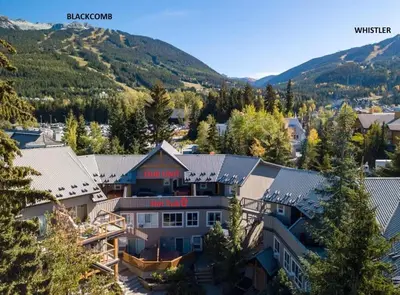 an aerial view of a house with mountains in the background at Whistler Village North Retreat - Private Hot tub in Whistler