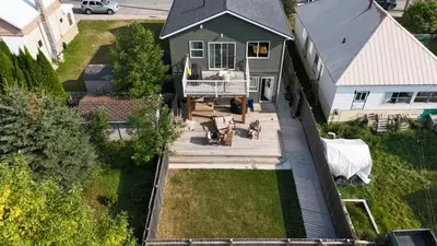 an aerial view of a house with a backyard at 2 BDRM Homes on 2nd Avenue in Fernie
