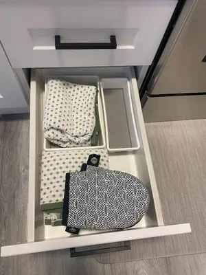 a room with a suitcase and a bed at Private one Bedroom Suite for Rent in Calgary